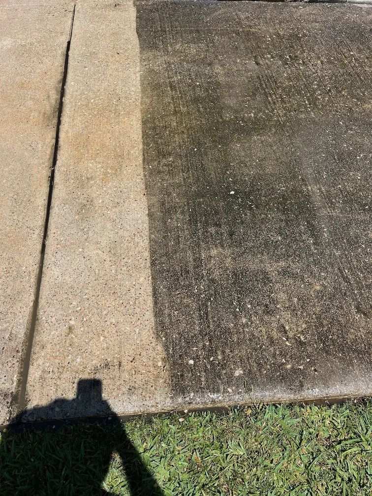 Pressure washing a concrete driveway in Gresham, OR